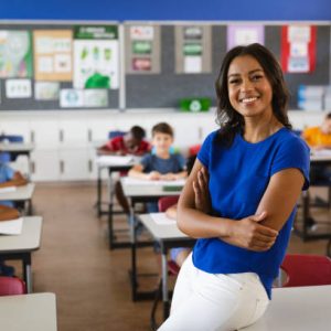 Portrait of african american female teacher smiling in the class at school. school and education concept